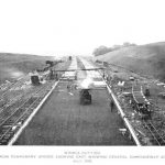 Black and white photo looking along the length of the East Lancashire Road as it was being built