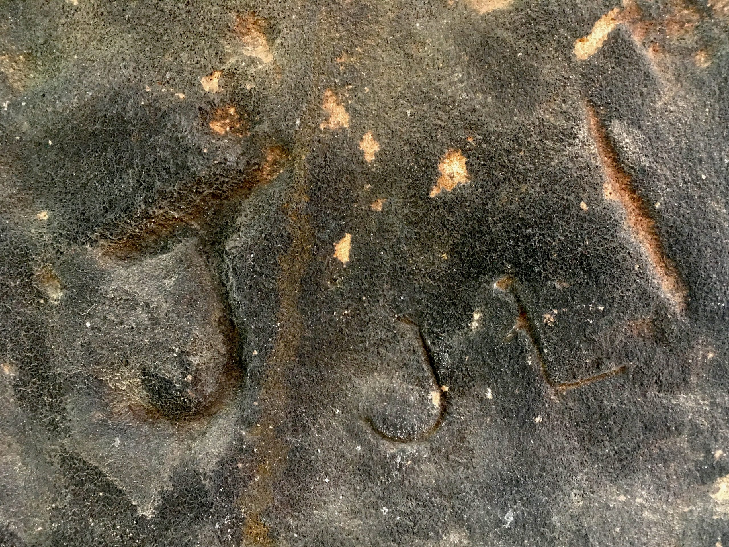 Photo to show carved initials on stone