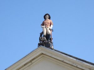 Photograph of the lumberjack statue on top of the former Dominion pub, Liverpool